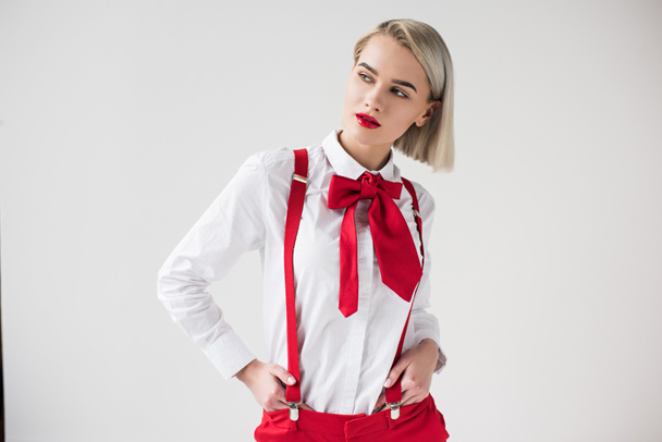 stylish girl in red suspenders and bow - Foto, Imagen