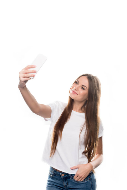 Girl taking selfie with smartphone - Φωτογραφία, εικόνα