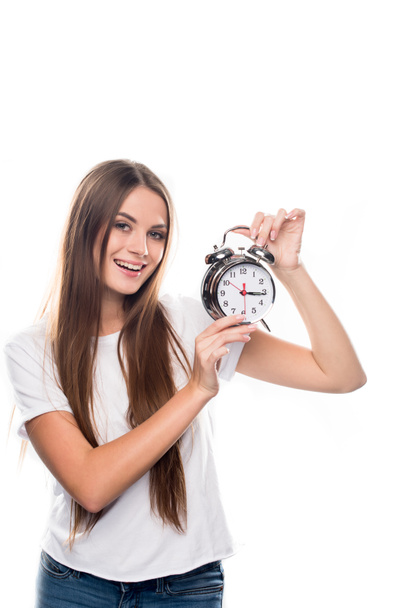 Girl holding alarm clock - Фото, зображення