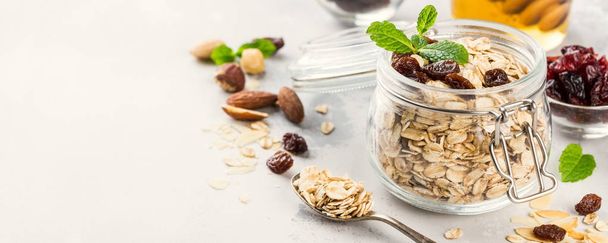 Oat flakes in glass jar - Photo, Image