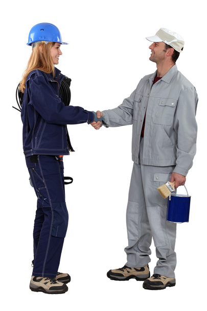 A painter and an electrician shaking hands. - 写真・画像