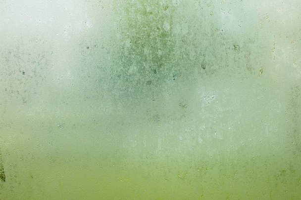 water drop of rain on window glass burred garden background. - Fotó, kép