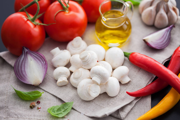 champignons, tomatoes, olive oil and garlic - Photo, Image