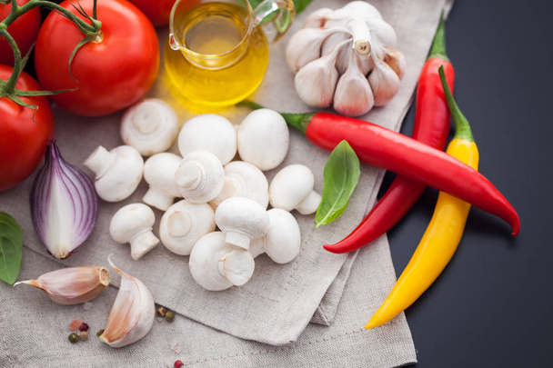 champignons, tomatoes, olive oil and garlic - Photo, Image