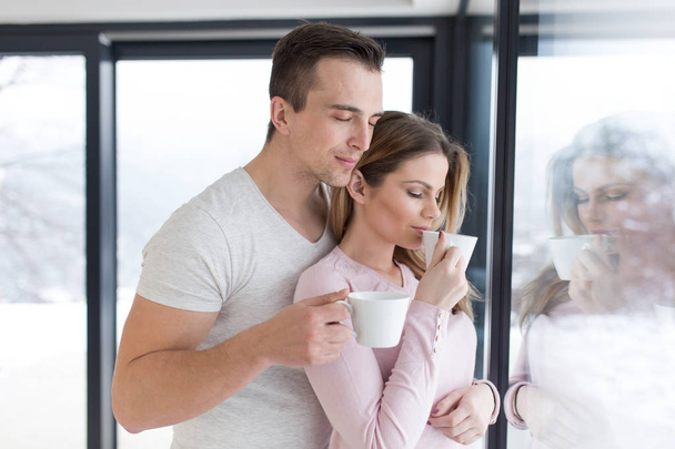 young couple enjoying morning coffee - Zdjęcie, obraz