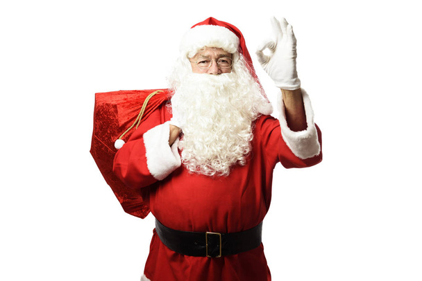 Санта-Клаус с подарками мешок Хорошо жест
 - Фото, изображение