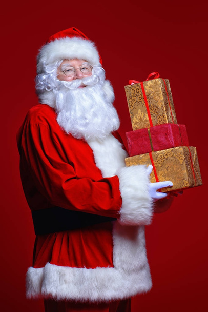 santa holding gifts - Фото, зображення