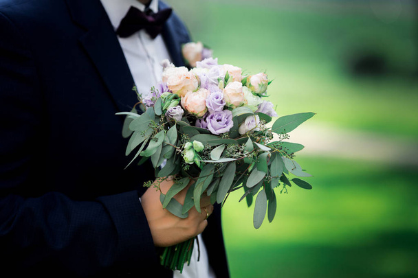 wedding bouquet in the hands of the groom - Photo, Image