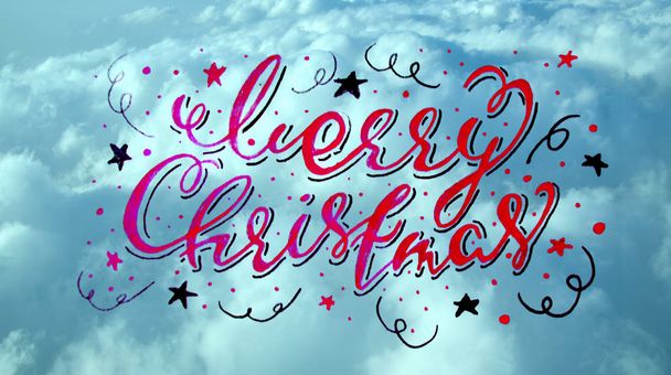 Joyeux Noël inscription calligraphique manuscrite sur une texture bleu ciel. toile de fond
 - Photo, image