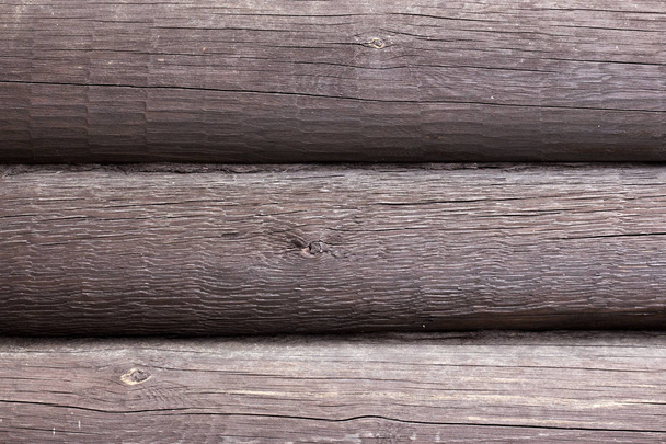 Τοίχος από σκούρο καφέ ξύλινα κούτσουρα φόντο - Φωτογραφία, εικόνα