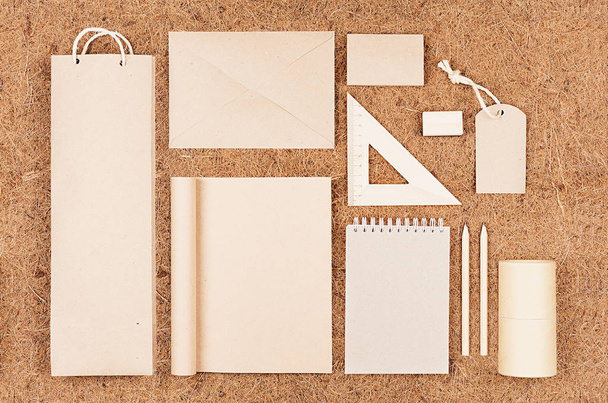 Eco blank packaging, stationery, gifts of  kraft paper  on   brown coconut fiber background.  - Foto, Bild