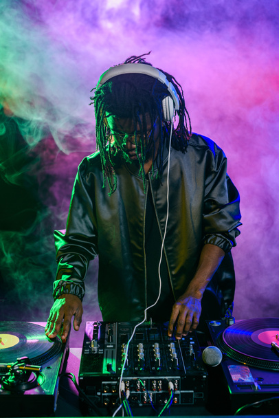 DJ in headphones with sound mixer - Photo, Image
