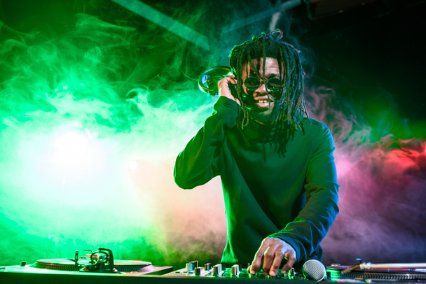 african american DJ in nightclub  - Fotografie, Obrázek