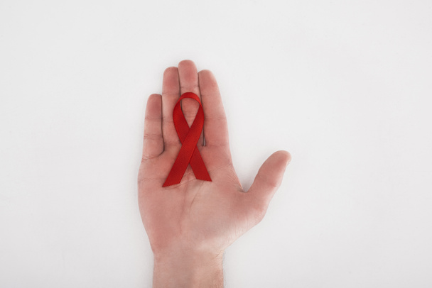 hand with red aids ribbon - Photo, Image