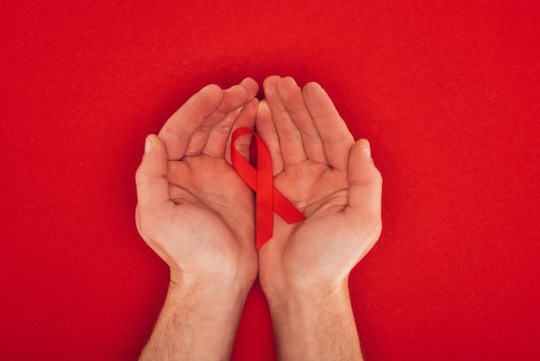 hands with aids ribbon - Foto, imagen