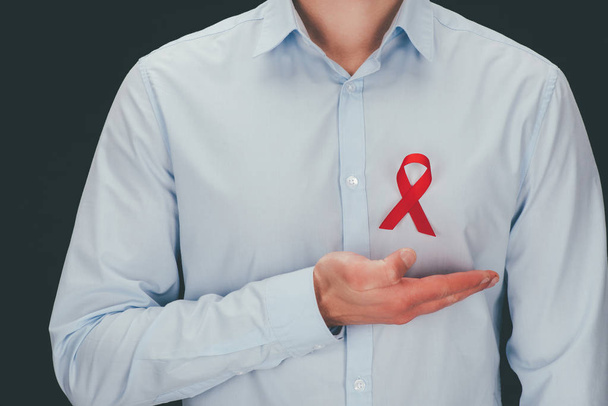 man with red aids ribbon - Φωτογραφία, εικόνα