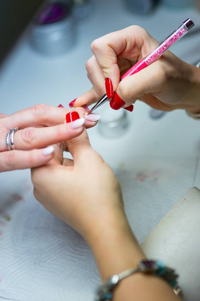 Nail Care and manicure. Nail care and the techniques of gel nail application - Fotoğraf, Görsel