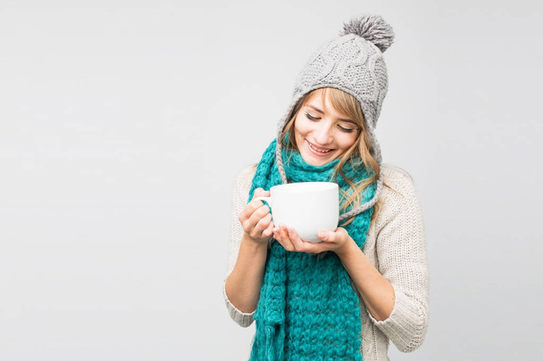 woman in knitted cap drinking tea  - Photo, Image