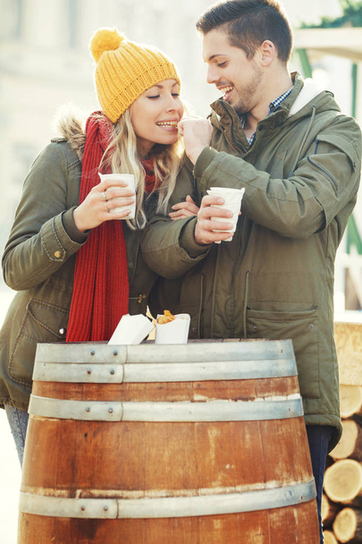 Happy Couple in Love Having Hot Drink and Snacks Outdoors - Φωτογραφία, εικόνα