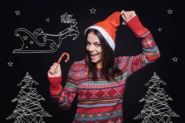 Cheerful young woman celebrating Christmas - Valokuva, kuva