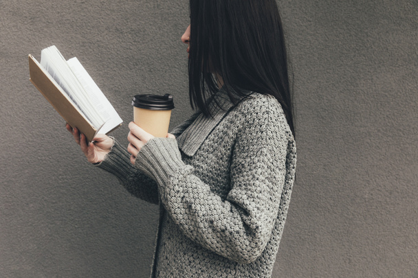 woman with book and coffee to go - Foto, Imagen