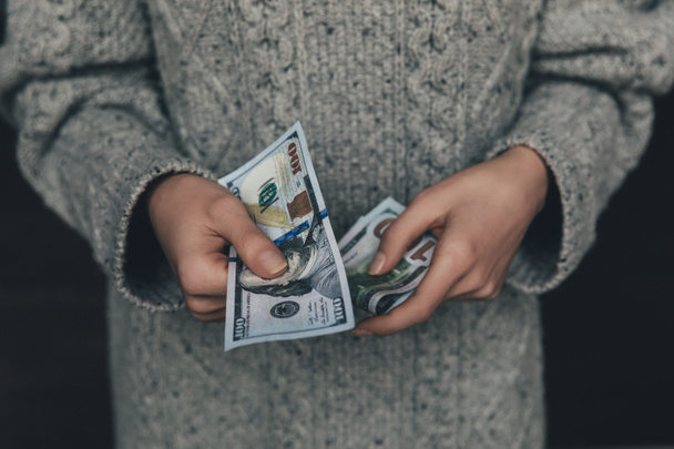 woman holding dollar banknotes - Photo, Image