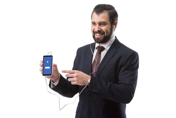businessman pointing at smartphone - Фото, изображение