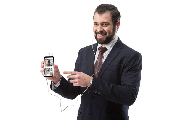 businessman pointing at smartphone - Fotoğraf, Görsel