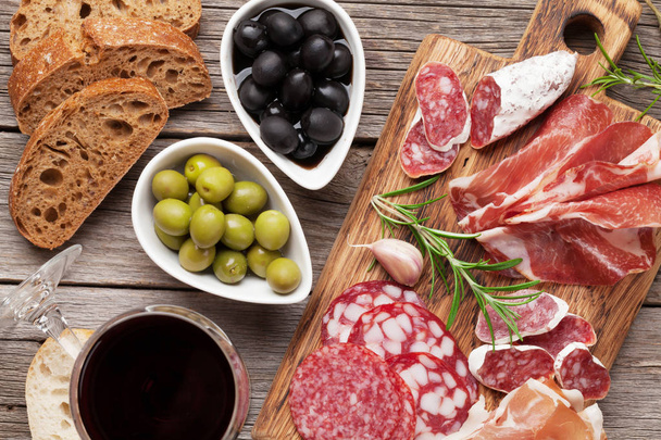 Salami, ham, sausage, prosciutto and wine - Photo, Image