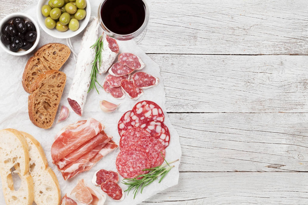 Salami, ham, sausage, prosciutto and wine - Photo, Image