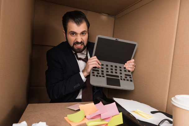 angry businessman with cardboard laptop - Photo, Image