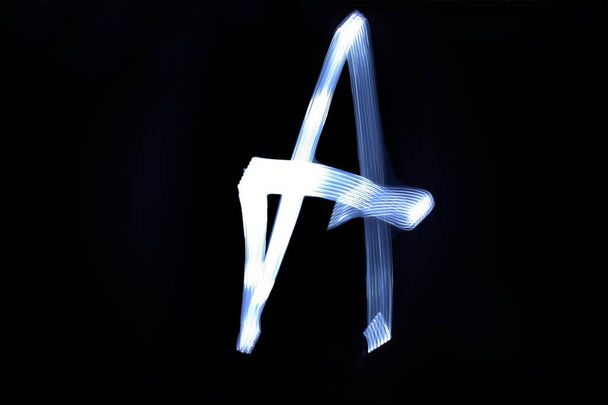 paint with light on black background letter A - Photo, Image
