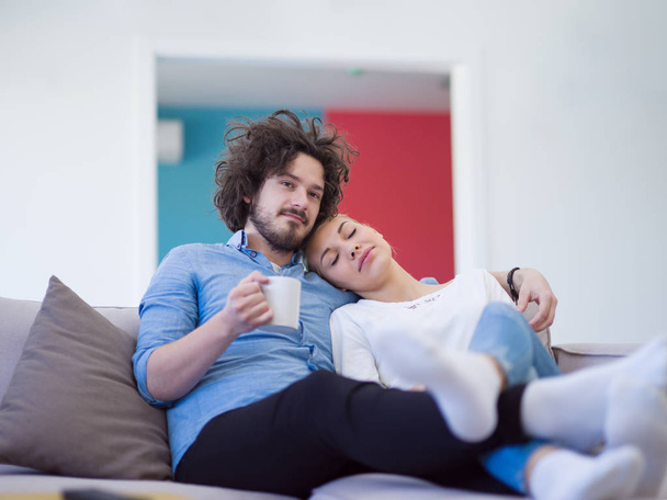 Young couple on watching television - 写真・画像