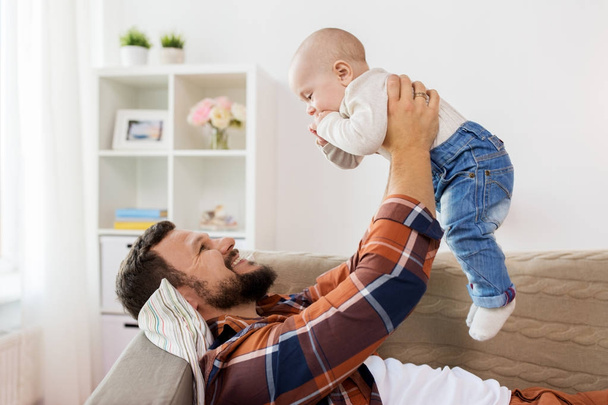 happy father with little baby boy at home - Foto, imagen