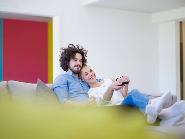 Young couple on watching television - Фото, изображение