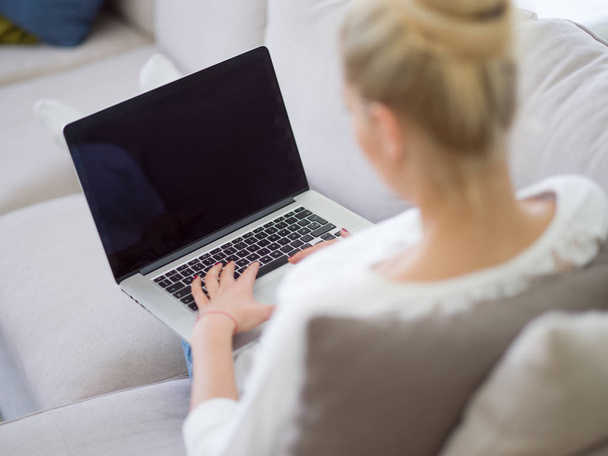 Woman using her laptop computer  - Фото, зображення