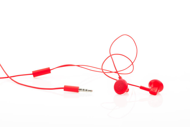 Red earphone isolated on white background. - Photo, Image