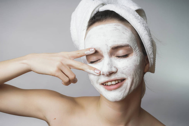 Amazed happy Woman use white cleanser mack,scrub on face - 写真・画像