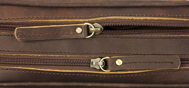 pair of zippers on the brown leather bag, top view - Photo, Image