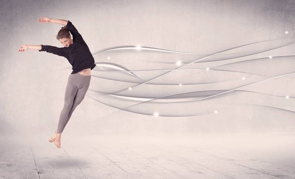 Tancerka baletowa wykonująca taniec nowoczesny z abstrakcyjnymi liniami  - Zdjęcie, obraz