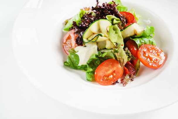 vegetables salad in the white plate - Valokuva, kuva