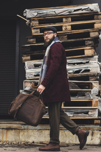 man in stylish clothing with leather bag - 写真・画像
