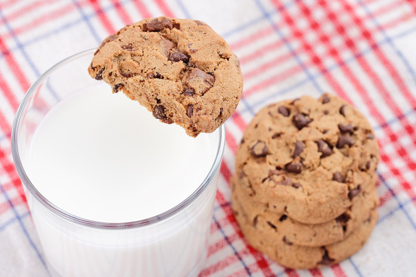 Cookie pile and fresh milk on table - Foto, Imagem