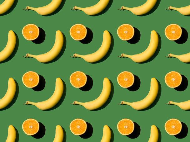 patroon met bananen en sinaasappelen  - Foto, afbeelding