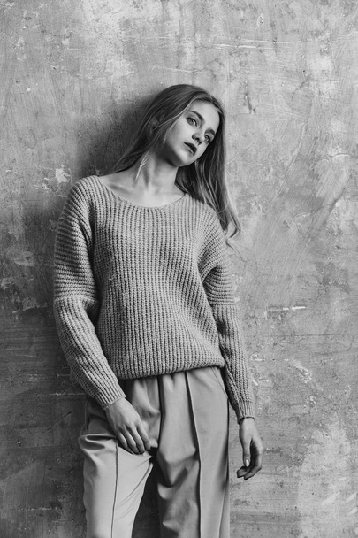 Pretty young girl with blond hair in fashionable sweater, culott - Zdjęcie, obraz