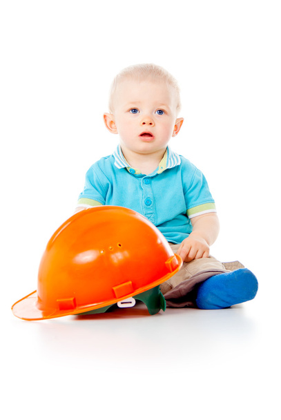 child with construction helmet - Foto, afbeelding