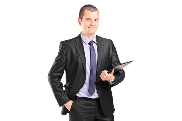 Businessman holding a clipboard - 写真・画像