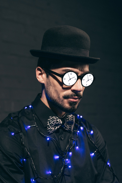 fashionable man with christmas lights - Foto, afbeelding