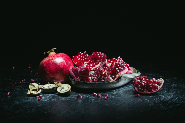 pomegranates in metal bowl - Фото, зображення