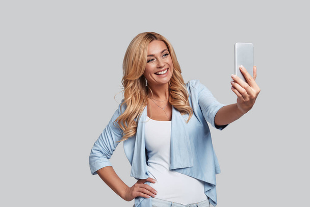 blonde woman taking selfie - Photo, Image